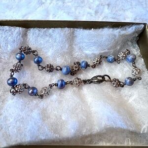 beautiful  handmade bracelet made of blue coral, silver tone accents beads
